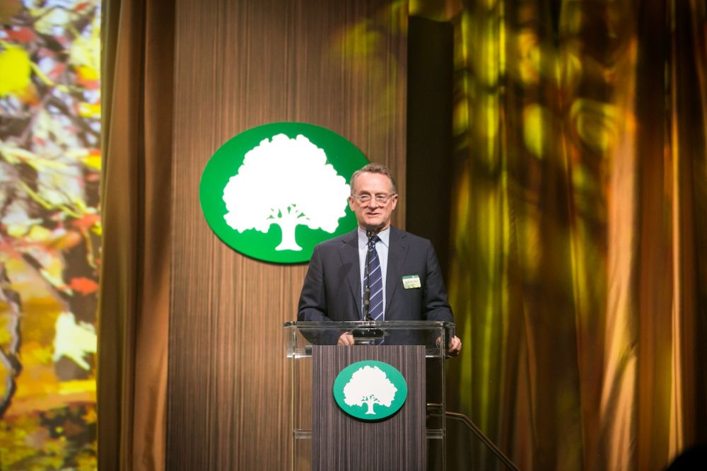 Co-founder Howard Marks delivers a captivating speech at an Oaktree event, sharing his vision for the company's future. Photo: Shutterstock.