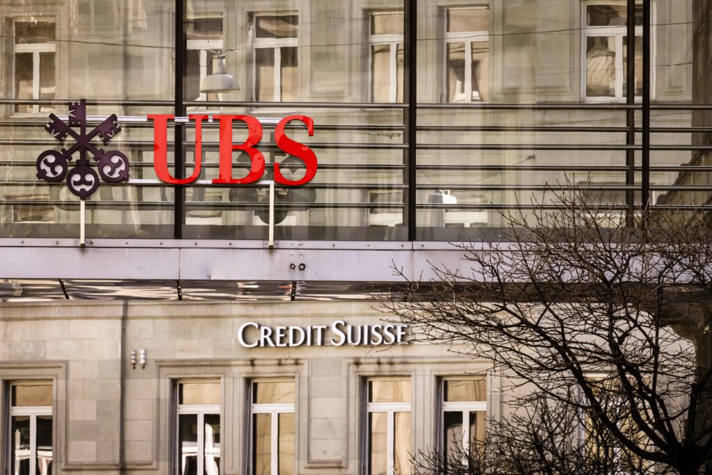 Operational Integration: UBS and Credit Suisse logos unite, hinting at the combined brand merger following their recent merger. Photo: Shutterstock