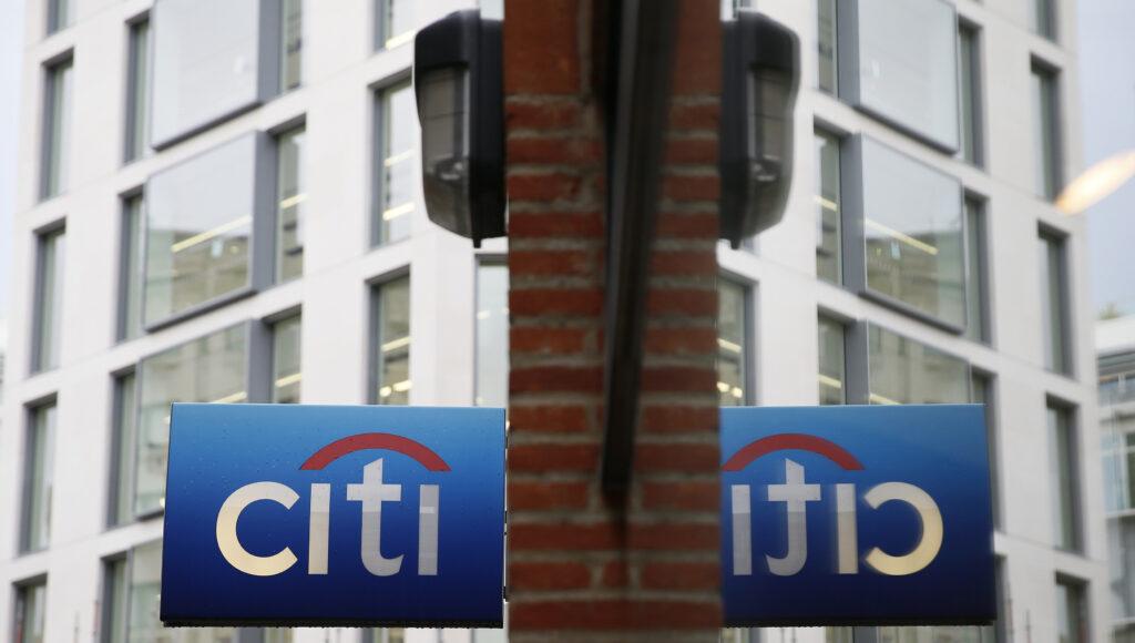 A Citibank sign is reflected in a window in the City of London November 12, 2014.  Photo: Getty Images