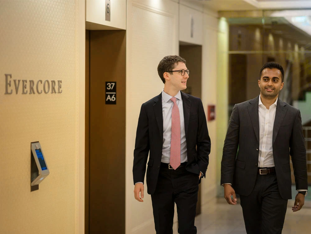 Evercore Bankers Walking Through the Office Hallways in New York. PHOTO: Evercore Media