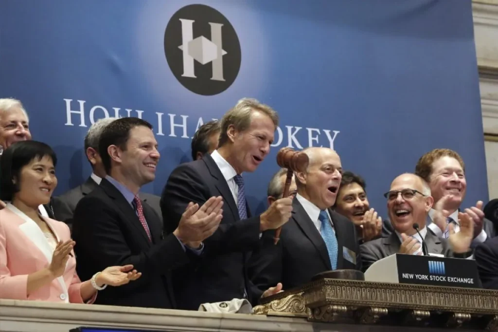 Houlihan Lokey Chief Executive Scott Beiser, fourth from left at the New York Stock Exchange to commemorate the company’s IPO in 2015. PHOTO: Richard Drew / Associated Press