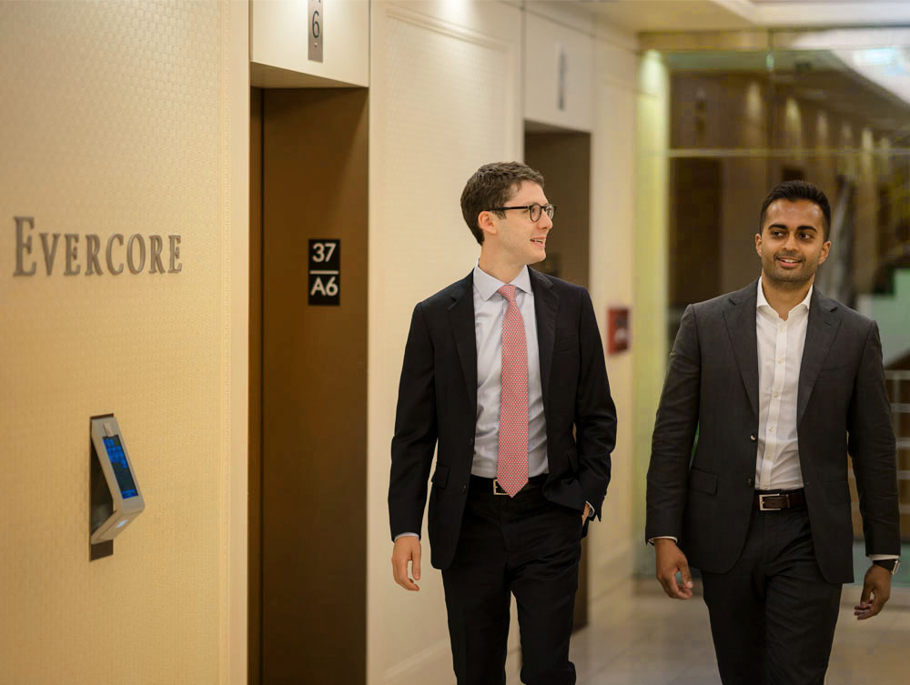 Evercore Bankers Walking Through the Office Hallways. PHOTO: Evercore/Shutterstock